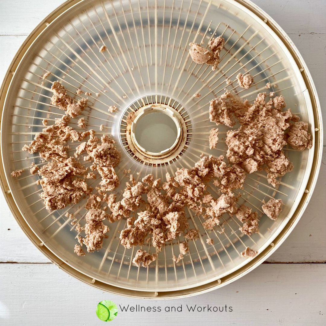 Almond pulp left over from blending almond milk. I use a solid Nesco tray to dehydrate the pulp to use in other recipes (instead of composting it or discarding it).