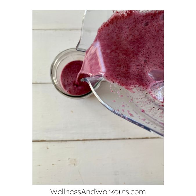 frozen fruit smoothie for weight loss pouring from Vitamix blender into mason jar