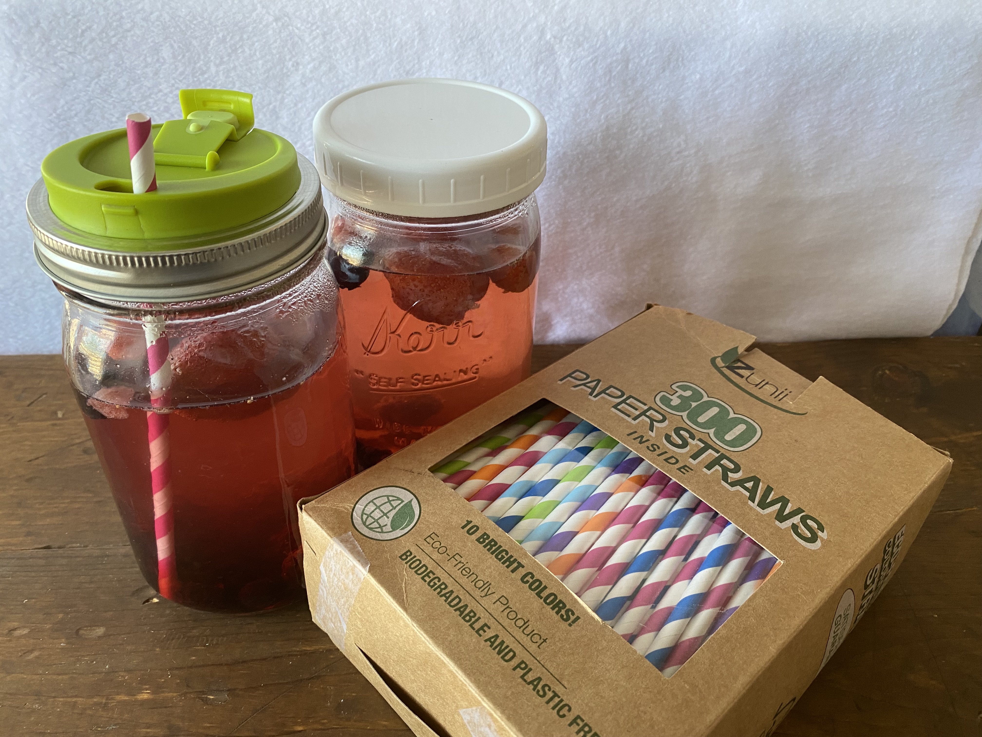 Mason jars with lids and straws, perfect for taking your weight loss smoothie or spa water with you on the go.